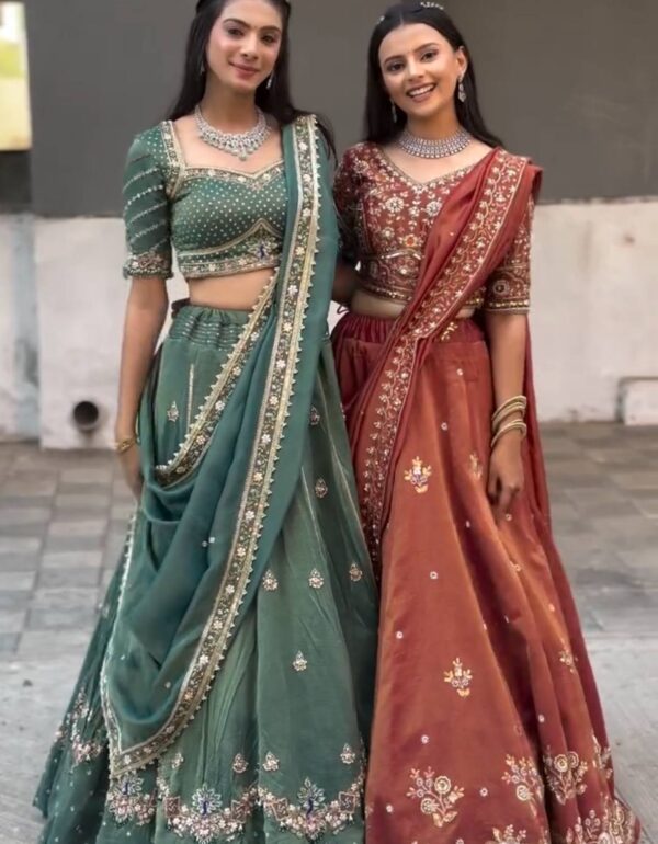 Harshita Emerald Green & Rust Maroon in Intricate Zari Embroidery with Stone Lehenga Choli