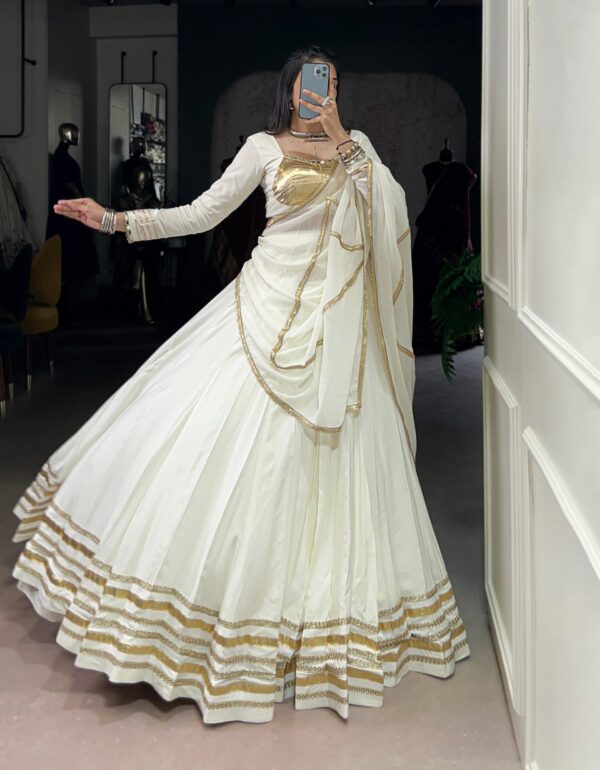 Rhea’s Ethereal Look White & Gold Flow Lehenga Set for Regal Evenings